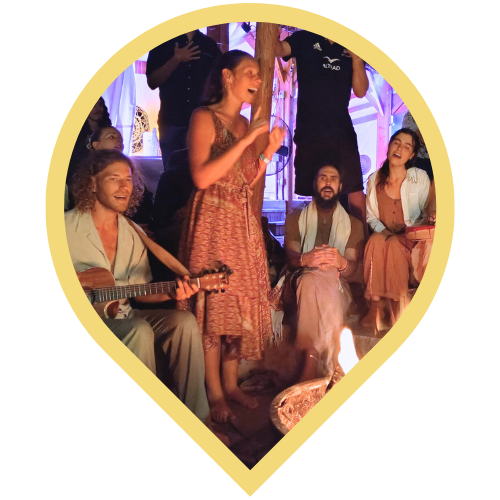 song circle with freedom family band around the fire